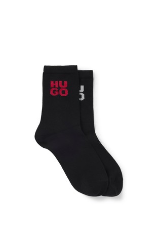 Two pairs of socks with sparkly logos