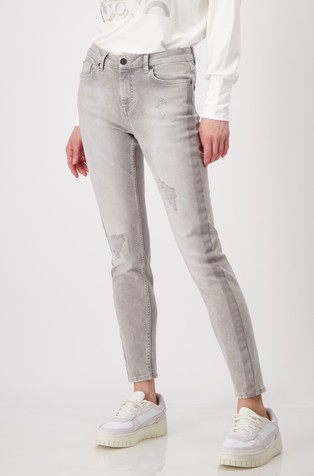 Jeans hlače z raztrganinami in kontrastnimi črtami