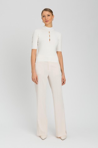Turtleneck jumper with cut-outs and studs