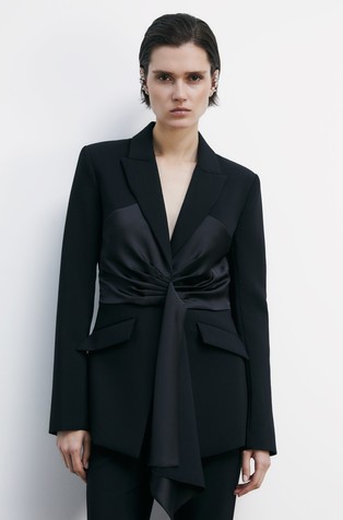 Suknjič s satenastim vstavkom