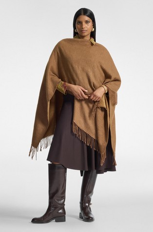 Reversible poncho with monograms and fringes