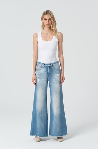 Jeans flare made in distressed denim with bleached wash