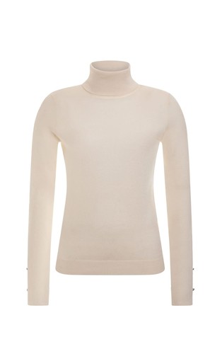 Turtle neck sweater with cut outs along sleeves