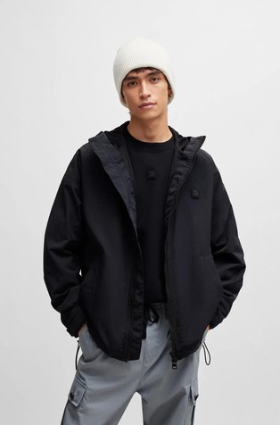 Water-repellent hooded windbreaker with stacked-logo badge