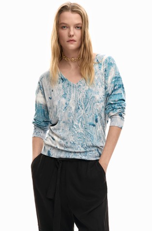 Pleten pulover z V-izrezom in abstraktnim vzorcem