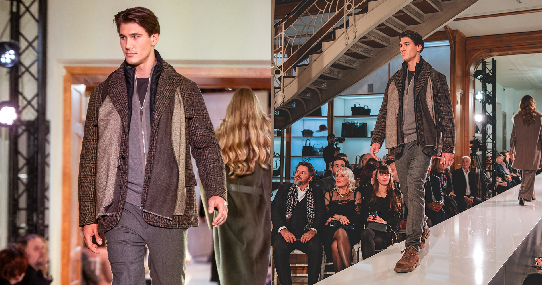 Male model in warm layered clothing in shades of grey walks down the runway among the audience.